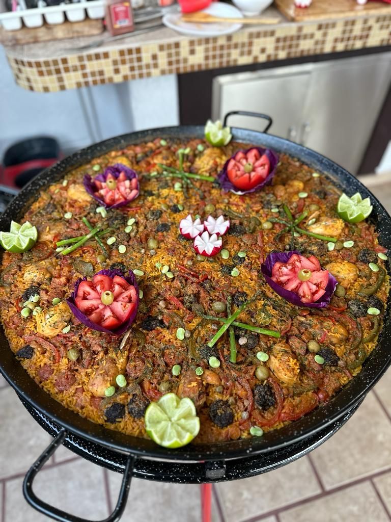 Mixed paella decorated with vegetable flowers